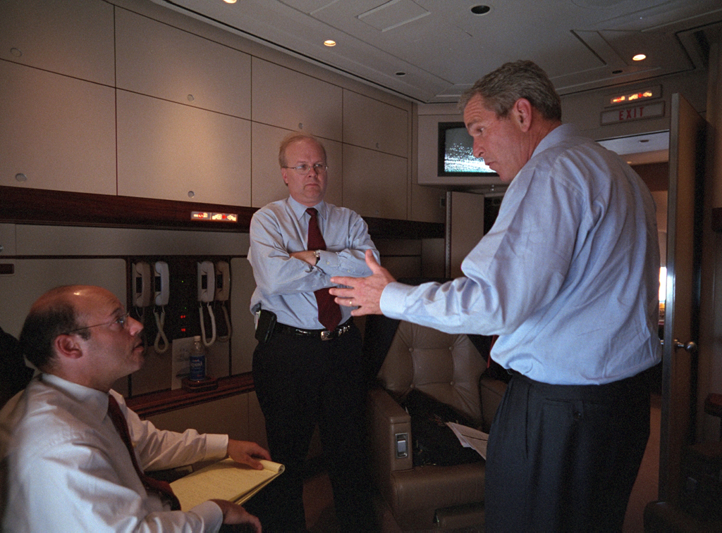 President George W. Bush speaks with Karl Rove (center) and Ari Fleischer, September 11, 2001, aboard Air Force One during the flight from Offutt Air Force Base in Nebraska to Andrews Air Force Base. (P7098-06)