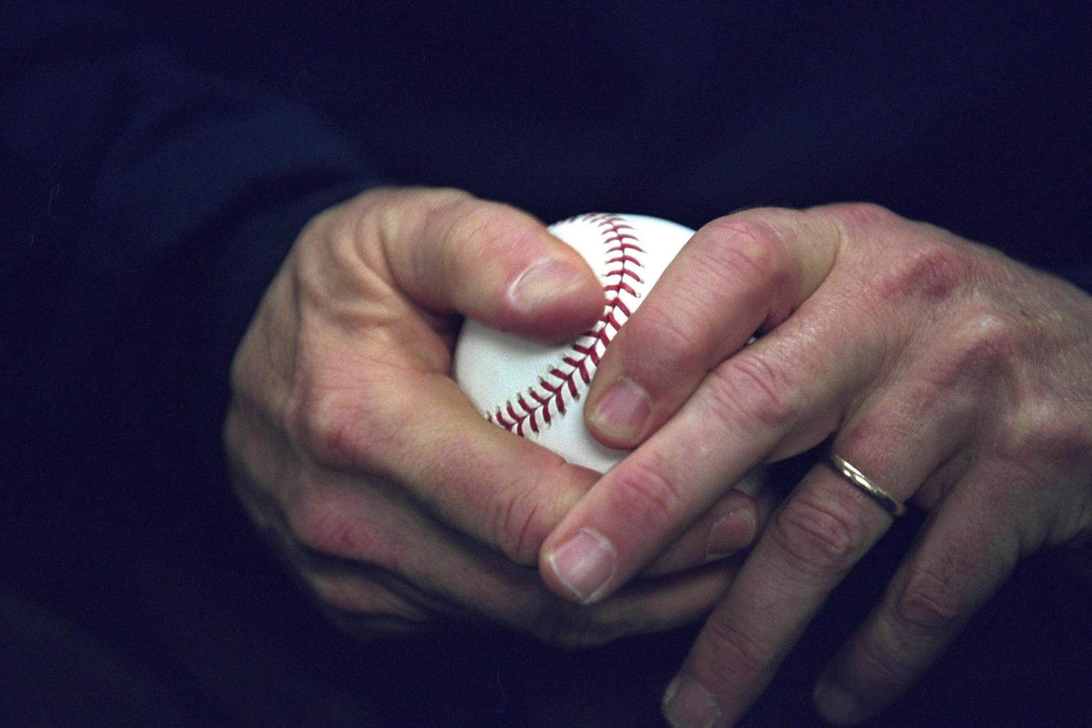 President George W. Bush holds a baseball, October 30, 2001, as he approaches the playing field at Yankee Stadium to throw out the ceremonial first pitch for Game Three of the World Series in New York City. (P9151-15)