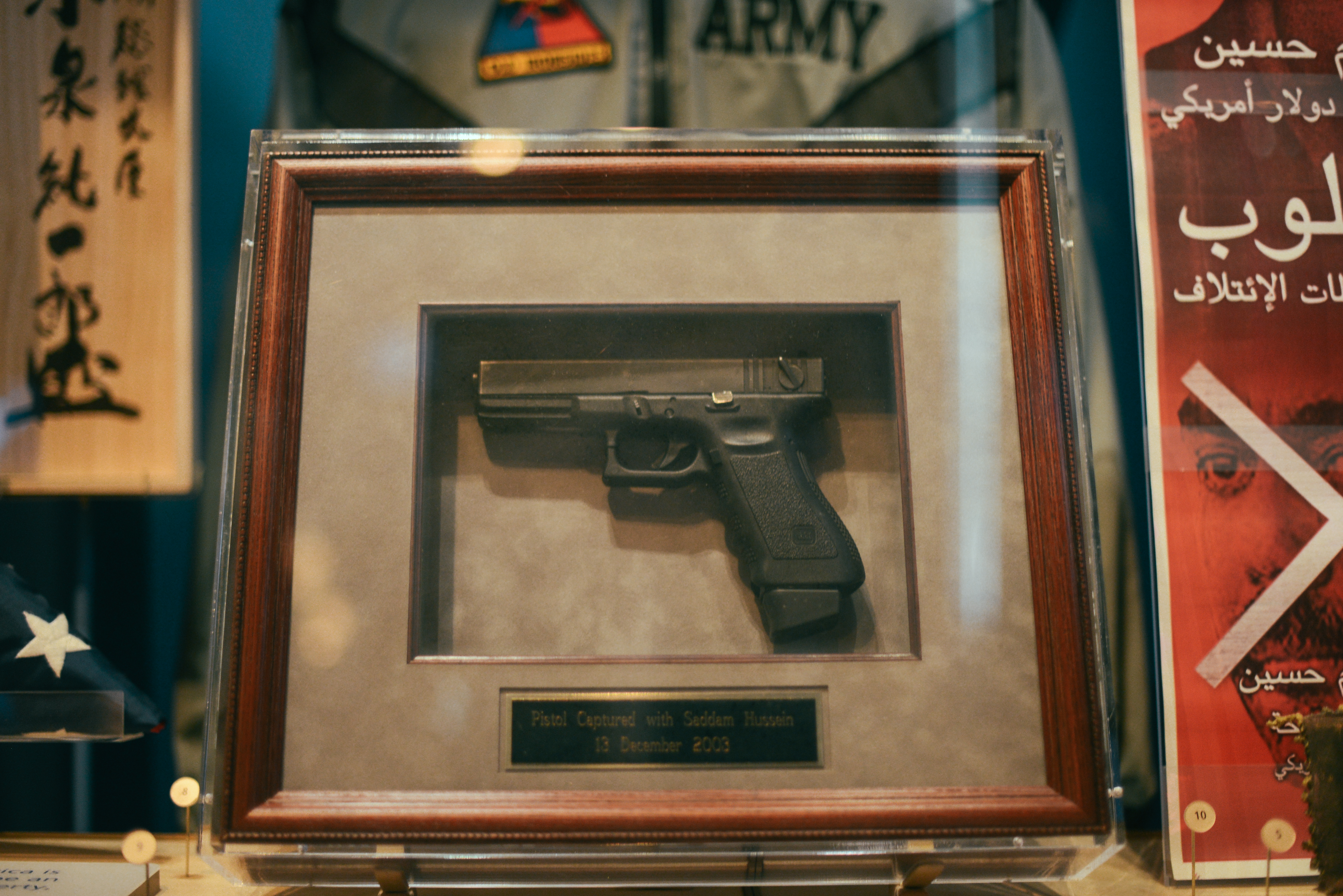 This 9mm Glock pistol was confiscated from Saddam Hussein when he was removed from the spider hole in Iraq. It is non-functional and was given to the President by the Military specialists who captured Saddam.