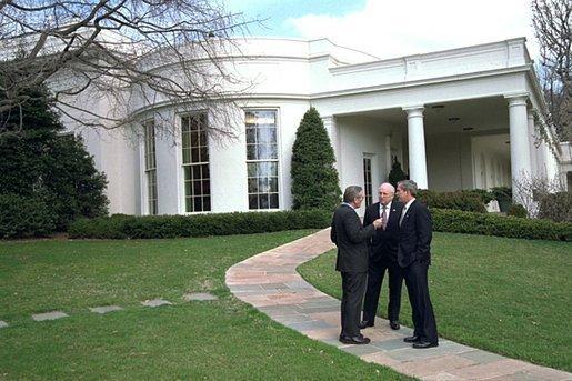 President George W. Bush meets with Vice President Dick Cheney and Secretary of Defense Donald Rumsfeld outside the Oval Office shortly after authorizing operation "Iraqi Freedom", March 19, 2003.