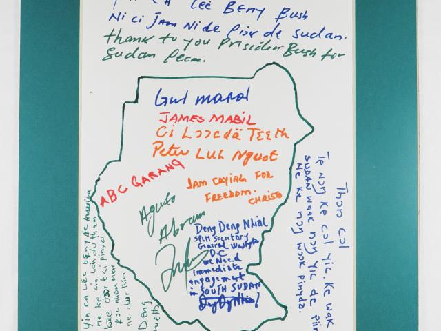 Drawing of Sudan with messages from gifters, Lost Boys of Sudan, Nashville, Tennessee. Presented to President Bush in the Roosevelt Room after his signing of the Sudan Peace Act (HR 5531) in October 2002.
